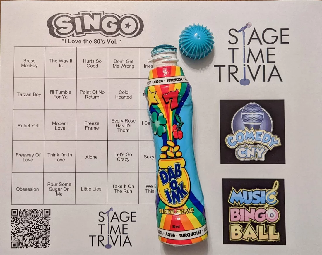 80s music bingo card with colorful dabber.