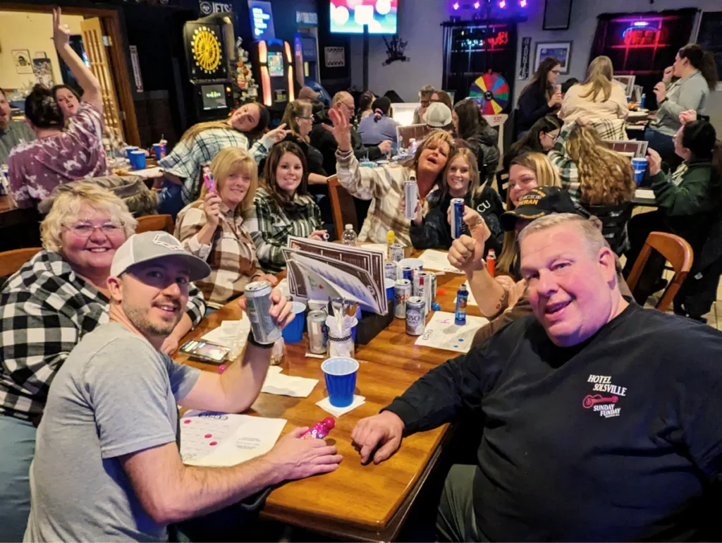 People enjoying social gathering in a lively restaurant.